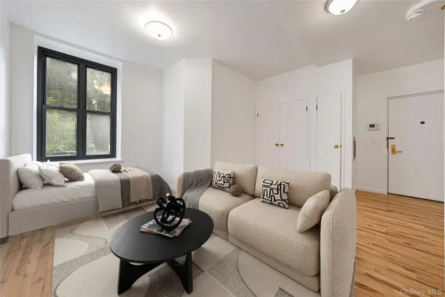 a living room with furniture and a window