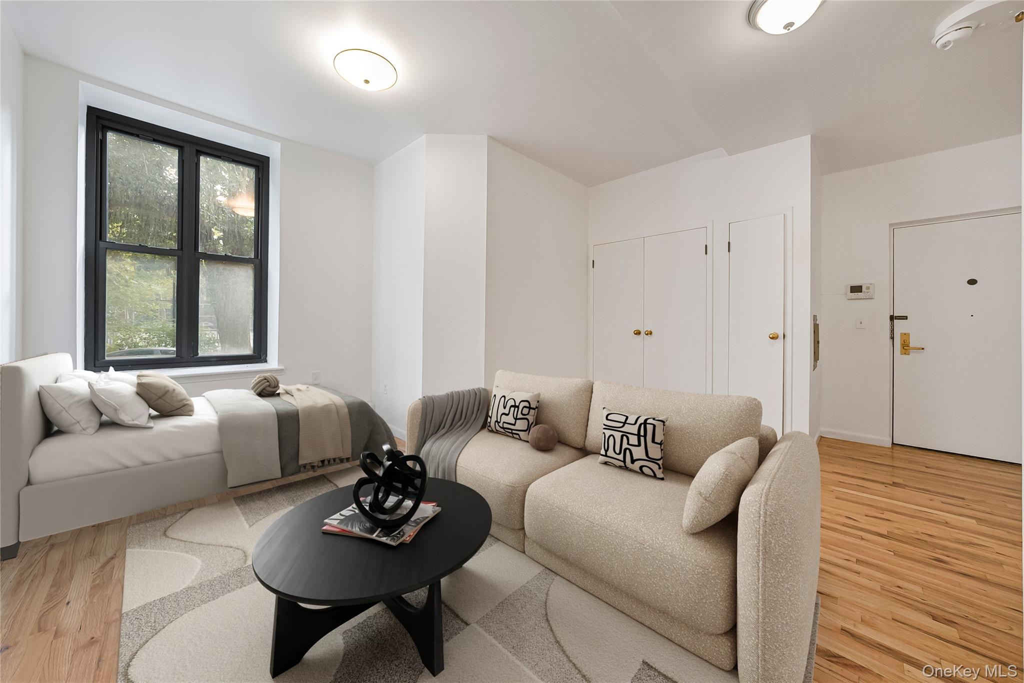 17 East 131st Street, Unit 1A Manhattan, NY 10037 - Photo 7 of 14 a living room with furniture and a window