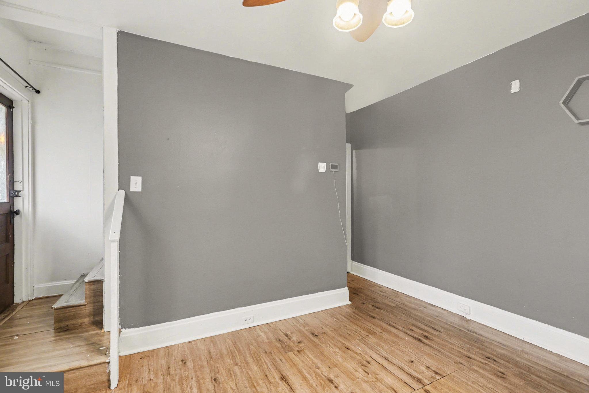 2721 Butler Street Harrisburg, PA 17103 - Photo 7 of 32 Spacious room with modern gray walls.