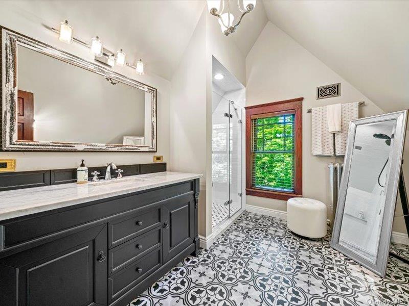 2 Pine Hill Road Chester, NY 10918 - Photo 12 of 31 a bathroom with a granite countertop sink a toilet a mirror and shower