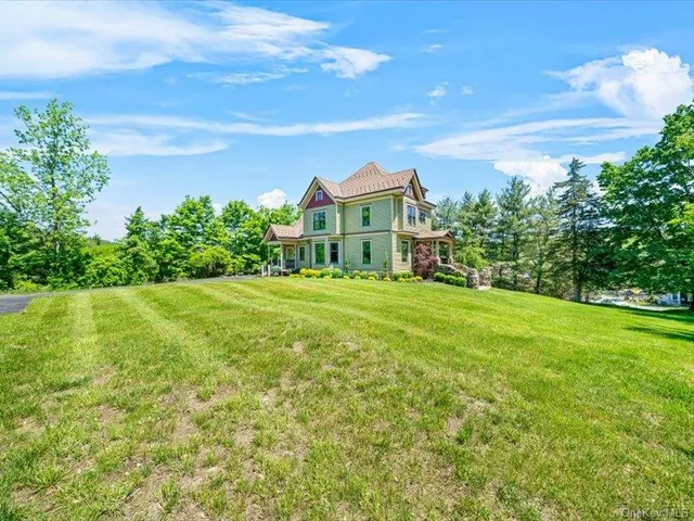 a view of a house with a big yard