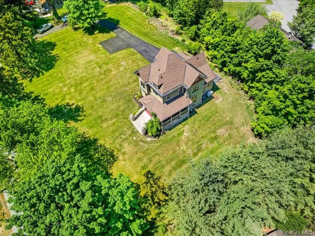 an aerial view of a house with swimming pool
