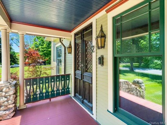 a view of a porch with wooden floor and outdoor space