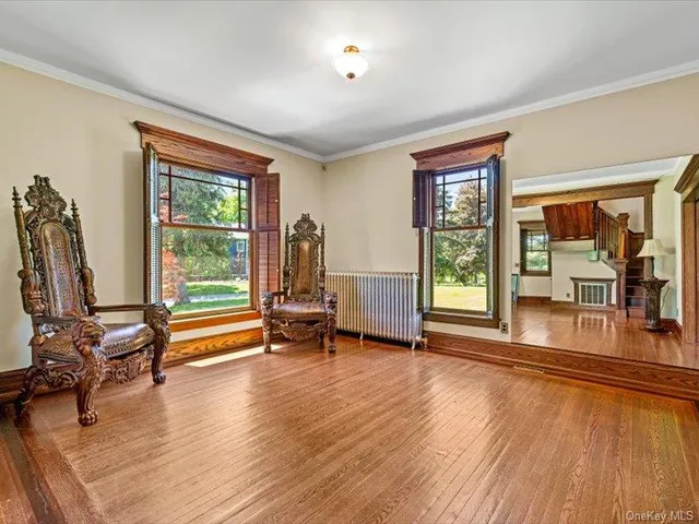 a view of a room with gym equipment and floor to ceiling window