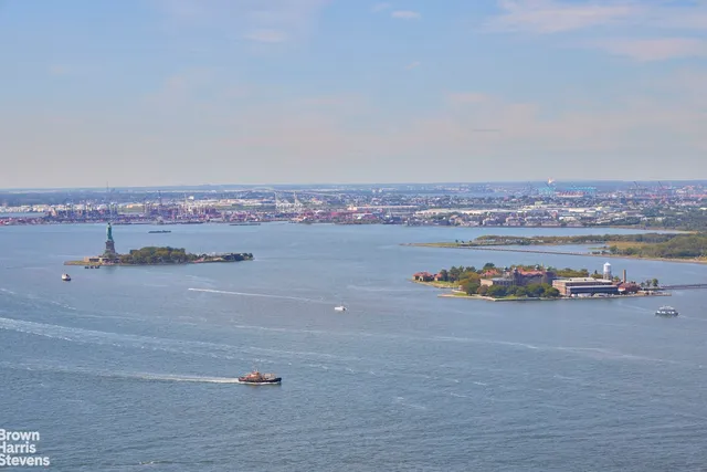 a bathroom with a double vanity sink a mirror and a shower
