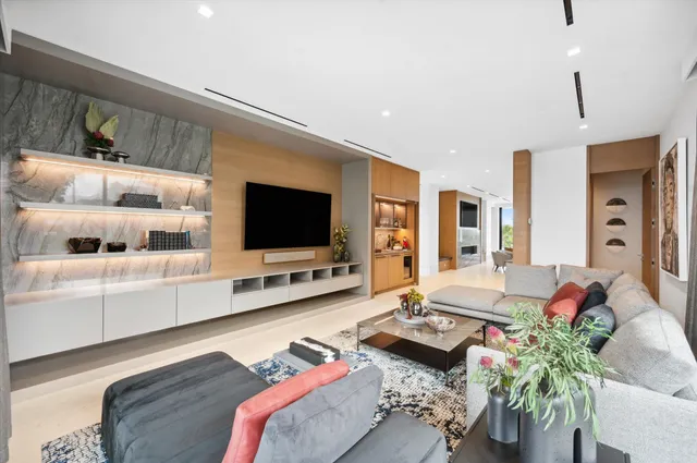 a view of a patio with table and chairs and garden