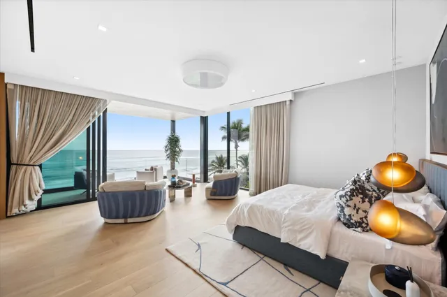 an aerial view of a city with ocean view