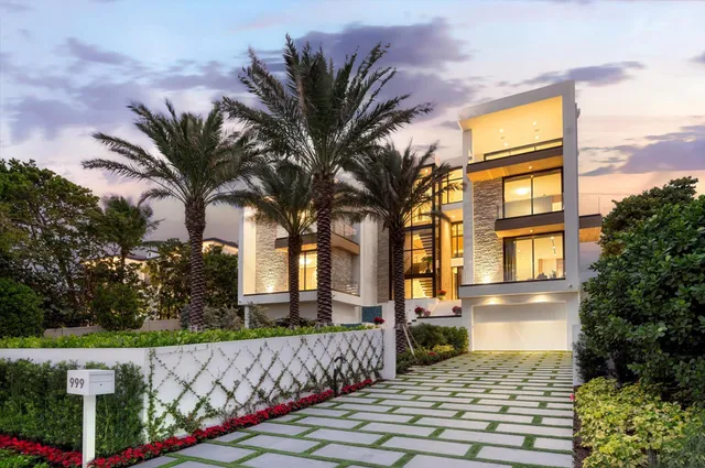 a living room with furniture and large windows