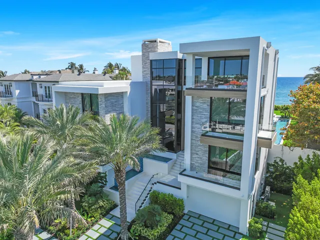 a dining room with furniture a window and a flat screen tv