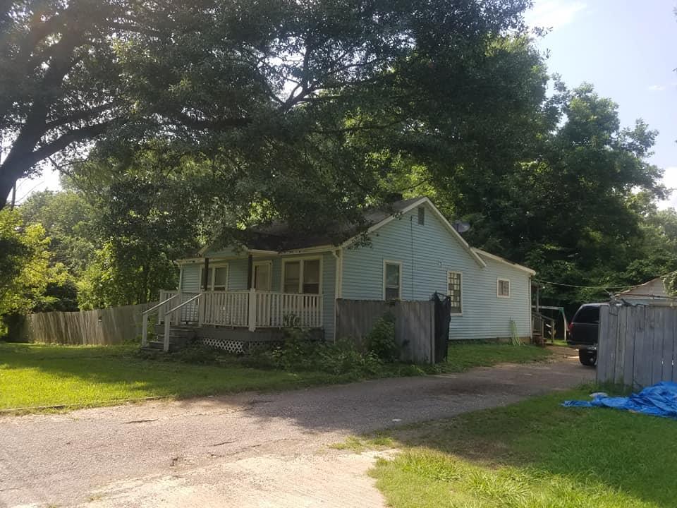 1358 Longcrest Road Memphis, TN 38109 - Photo 3 of 4 a front view of a house with garden