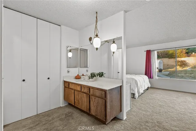a spacious bathroom with a double vanity sink a large mirror and a bathtub