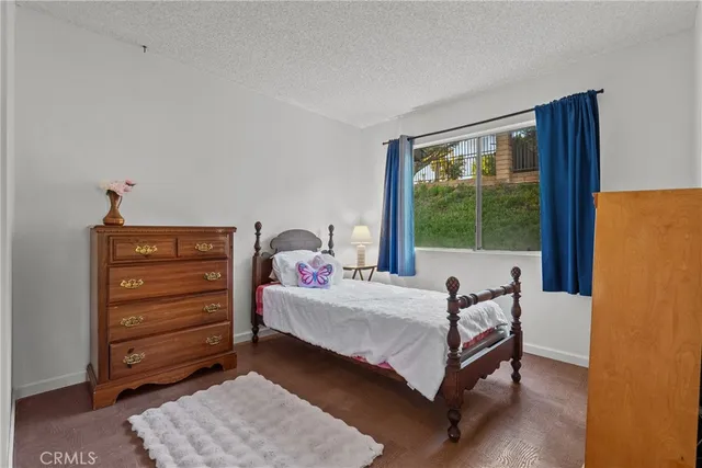 a bed room with a bed and a window