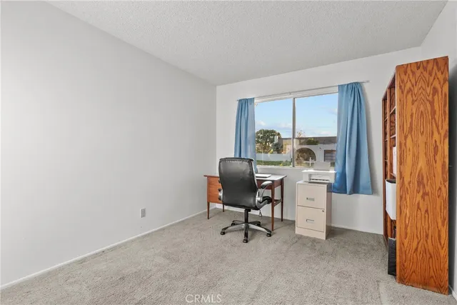 a workspace with furniture and window