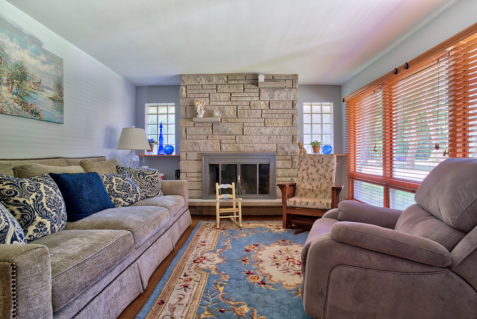 S703 Winfield Road Wheaton, IL 60189 - Photo 6 of 17 a living room with furniture a large window and a fireplace