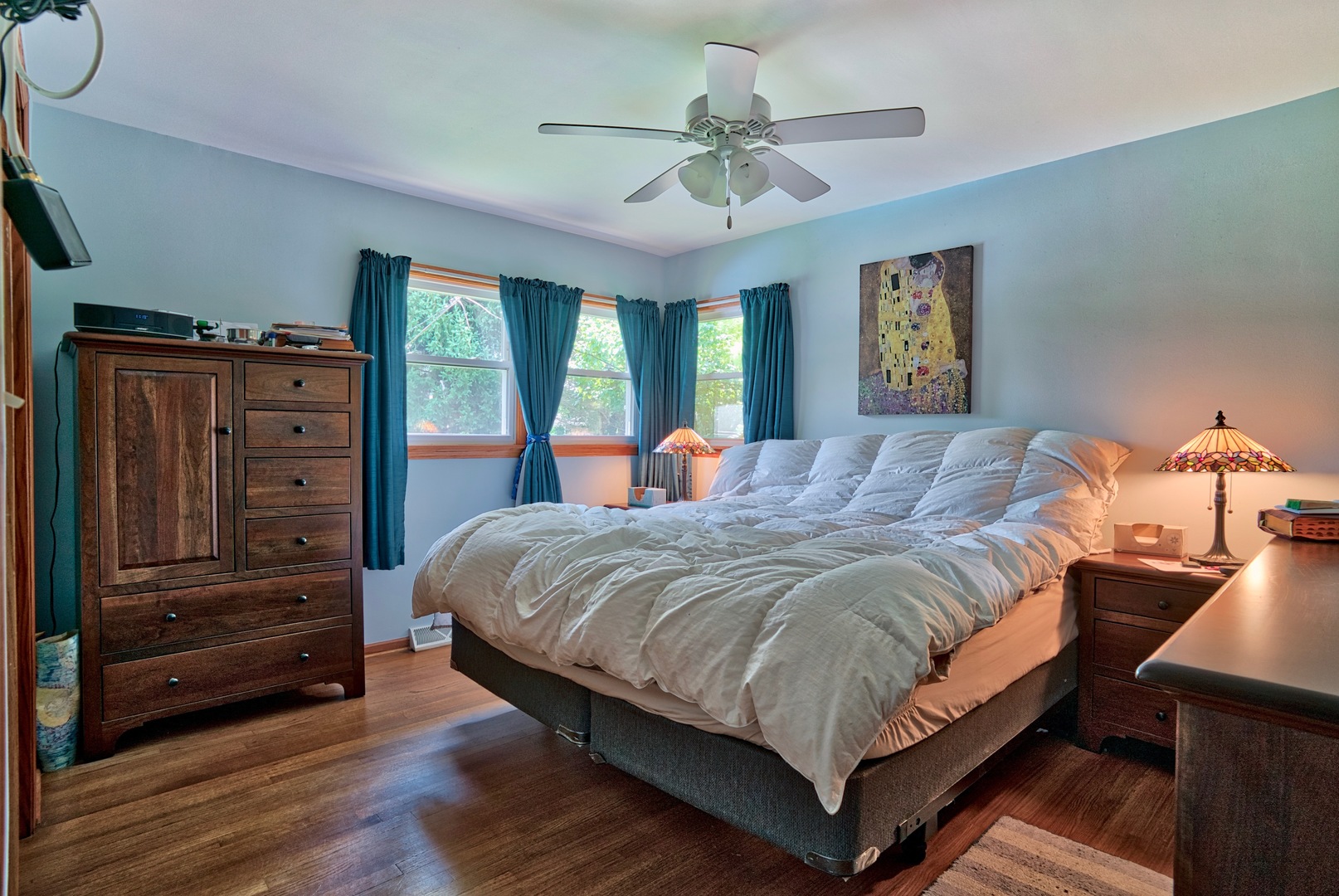 S703 Winfield Road Wheaton, IL 60189 - Photo 7 of 17 a bedroom with a bed and wooden floor
