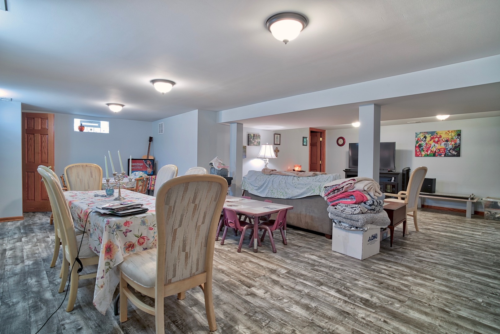 S703 Winfield Road Wheaton, IL 60189 - Photo 10 of 17 a living room with patio furniture and a wooden floor