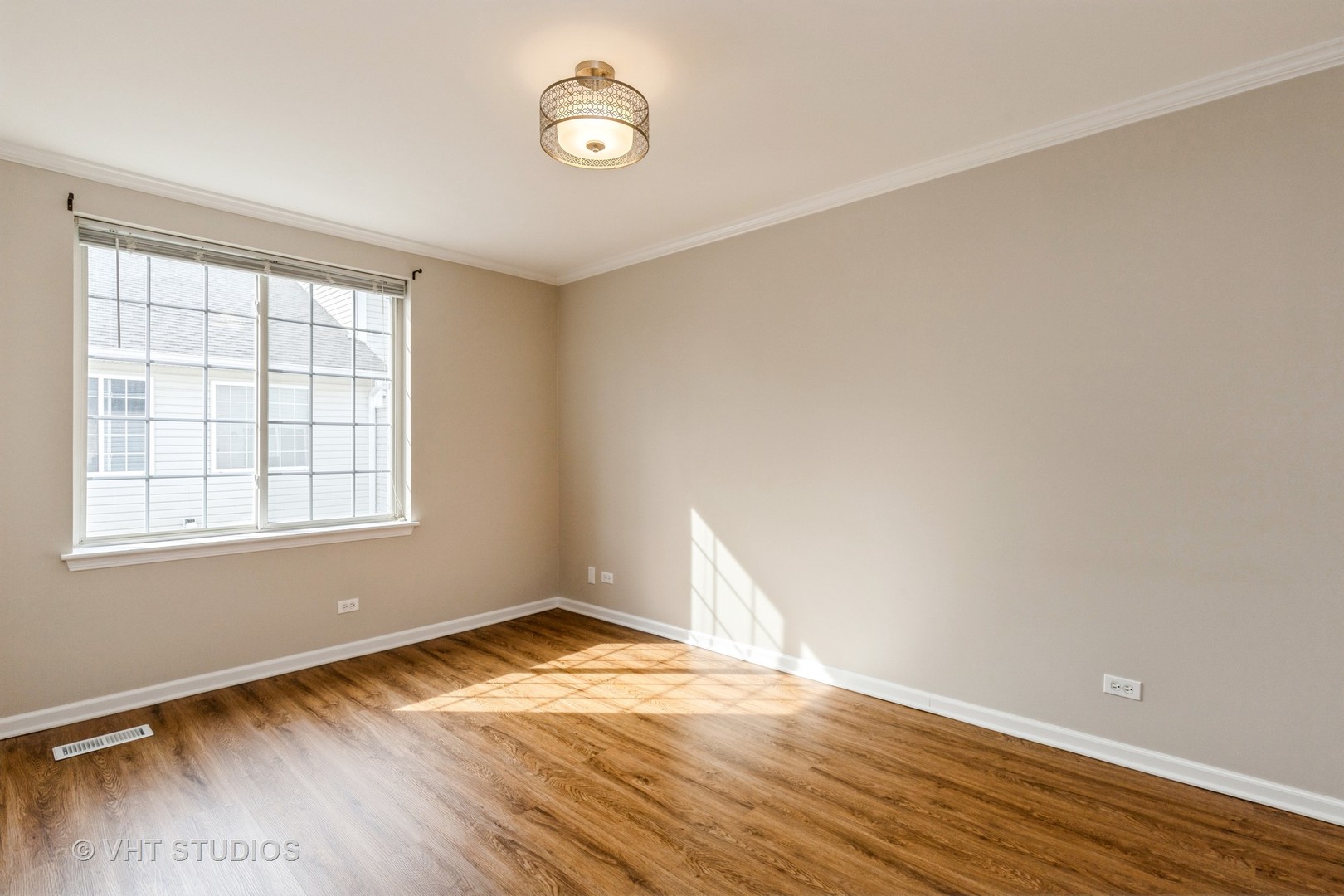 255 West Treehouse Lane Round Lake, IL 60073 - Photo 11 of 18 an empty room with wooden floor and windows