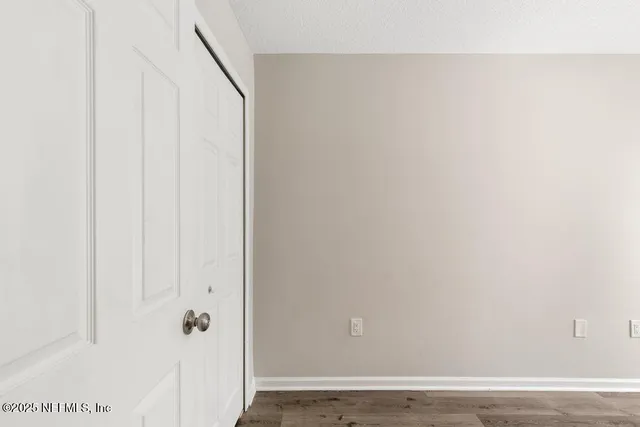 a bathroom with a toilet a sink a mirror and vanity