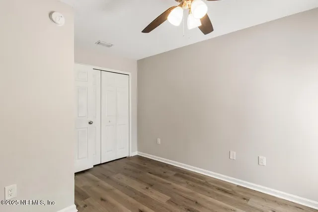 a view of an house with backyard and a slide