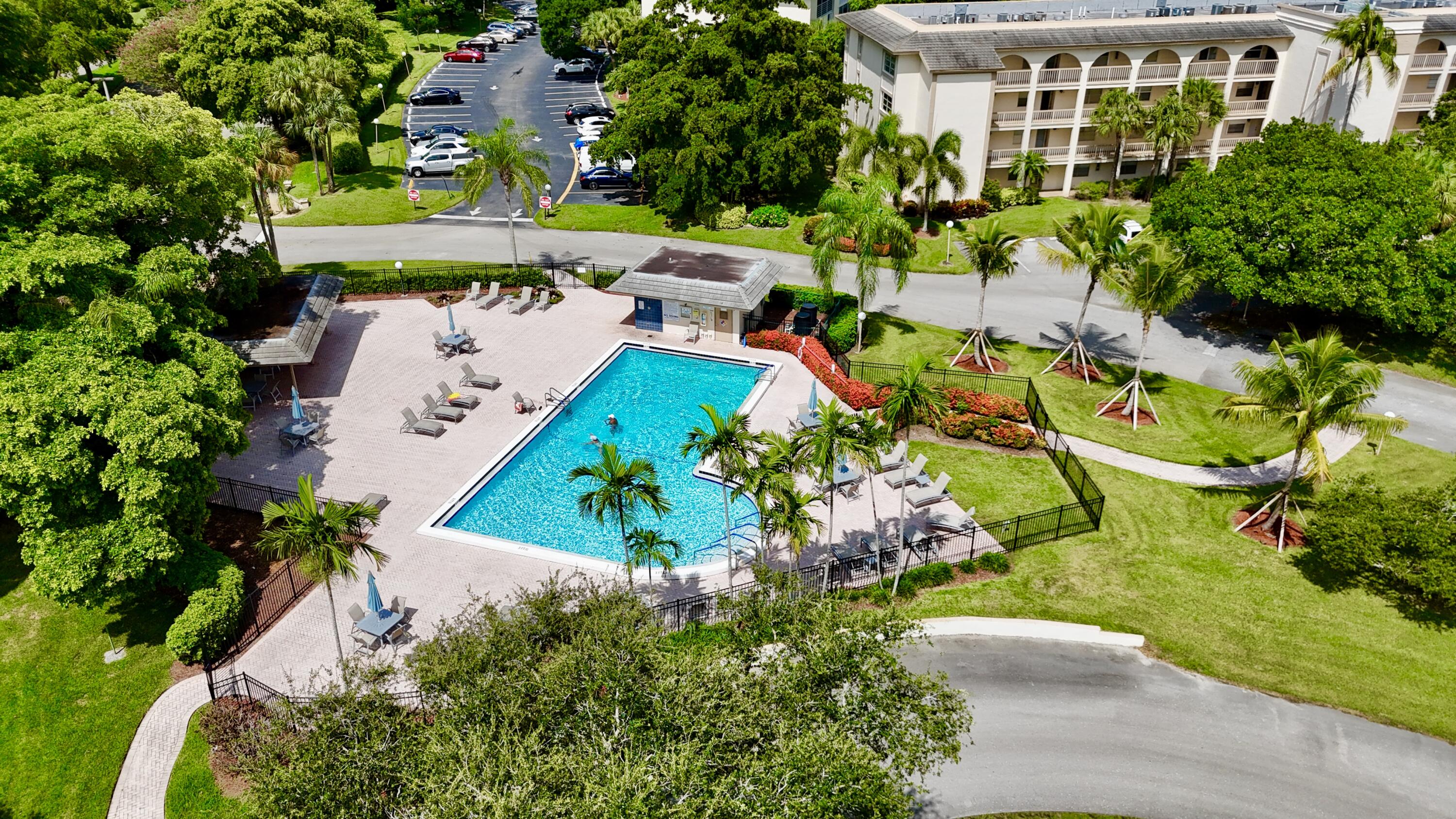 4401 Martinique Court, Unit G2 Coconut Creek, FL 33066 - Photo 12 of 22 an aerial view of a house with a yard and lake view