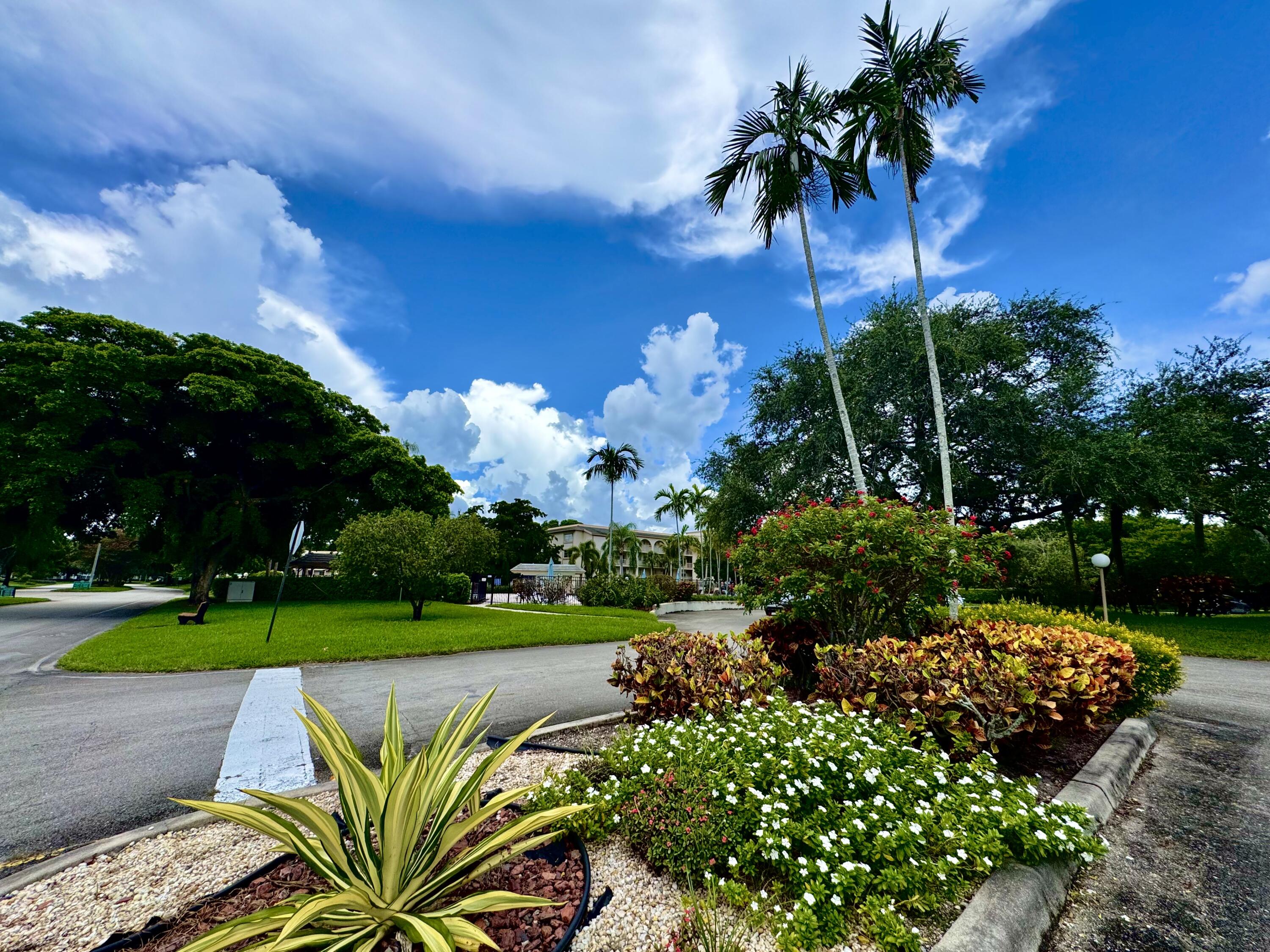 4401 Martinique Court, Unit G2 Coconut Creek, FL 33066 - Photo 18 of 22 a view of a garden with a flower in a garden