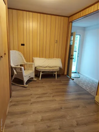 a living room with a furniture and a window