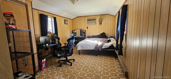 a bed room with a bed and a window