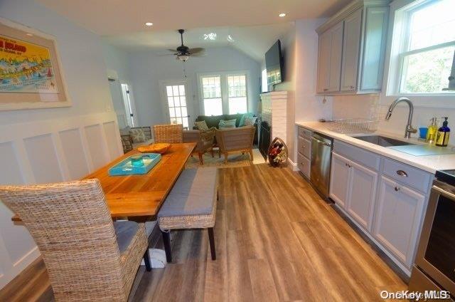 368 Surf Road Ocean Beach, NY 11770 - Photo 2 of 11 a large kitchen with wooden floor and stainless steel appliances