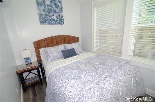 368 Surf Road Ocean Beach, NY 11770 - Photo 5 of 11 a bedroom with a bed and a window