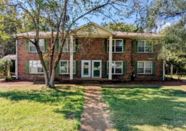 front view of a house with a yard
