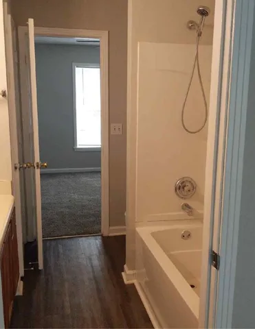 a bathroom with a bath tub and a shower