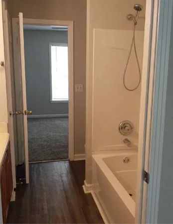 a bathroom with a bath tub and a shower