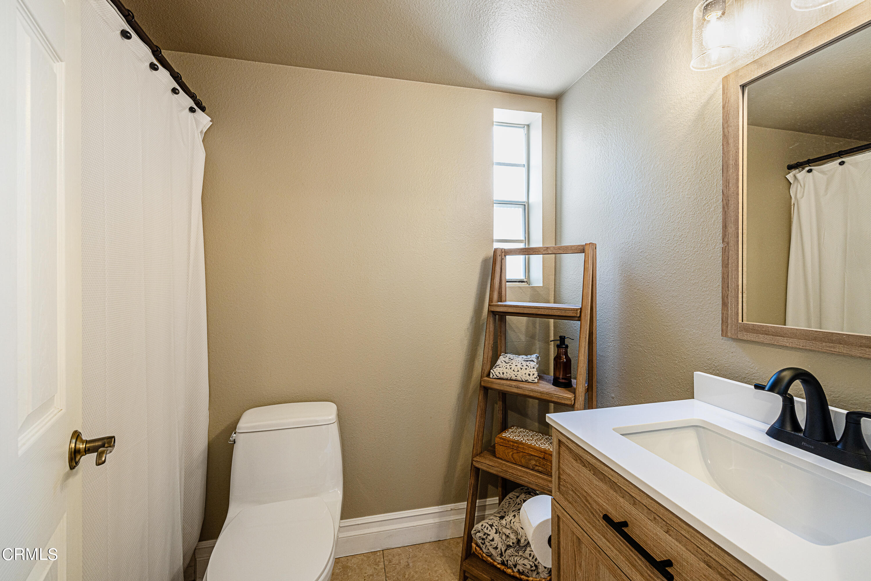 2891 Corte Caballos Camarillo, CA 93010 - Photo 14 of 30 a bathroom with a sink a toilet and a mirror