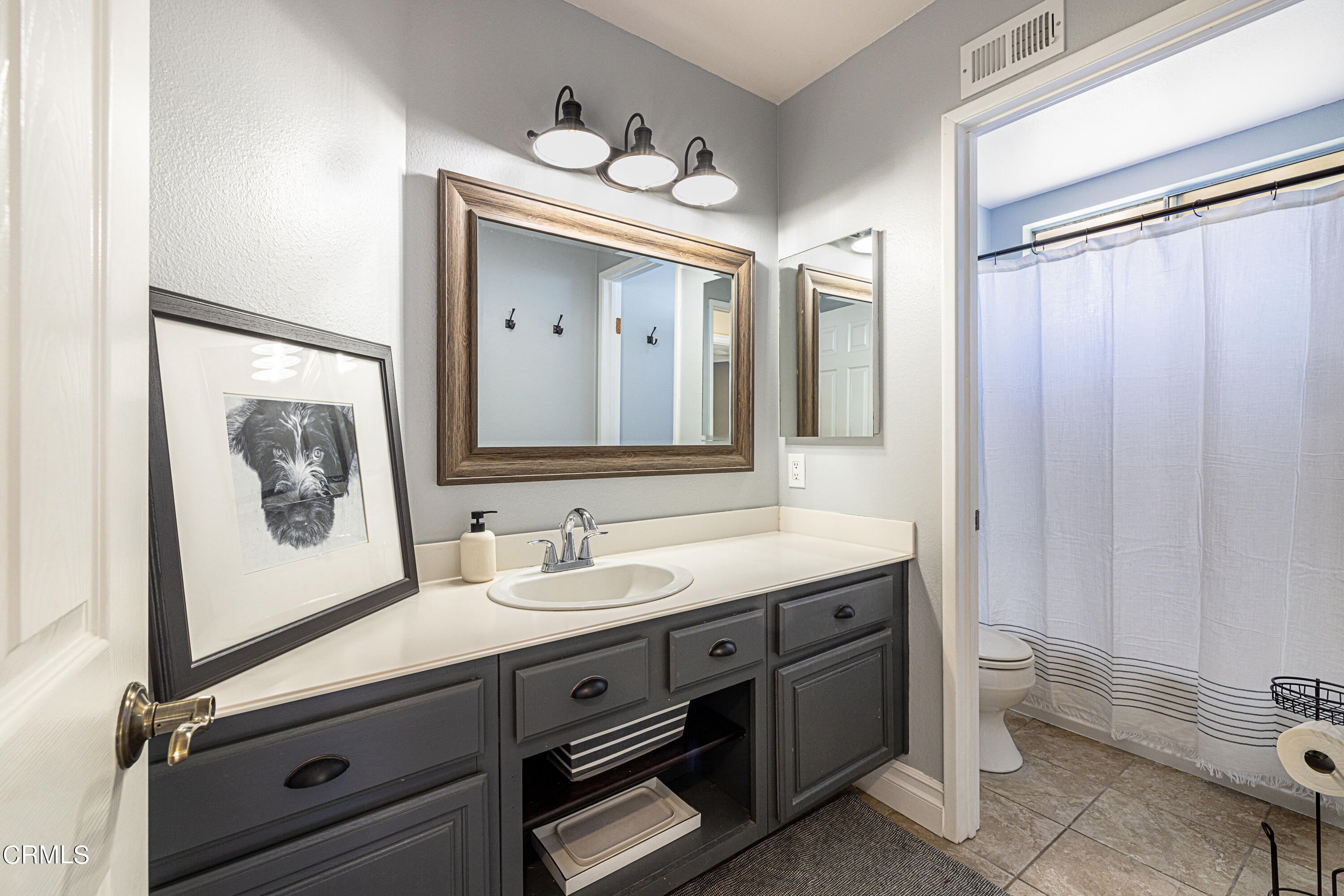 2891 Corte Caballos Camarillo, CA 93010 - Photo 18 of 30 a bathroom with a toilet sink and mirror