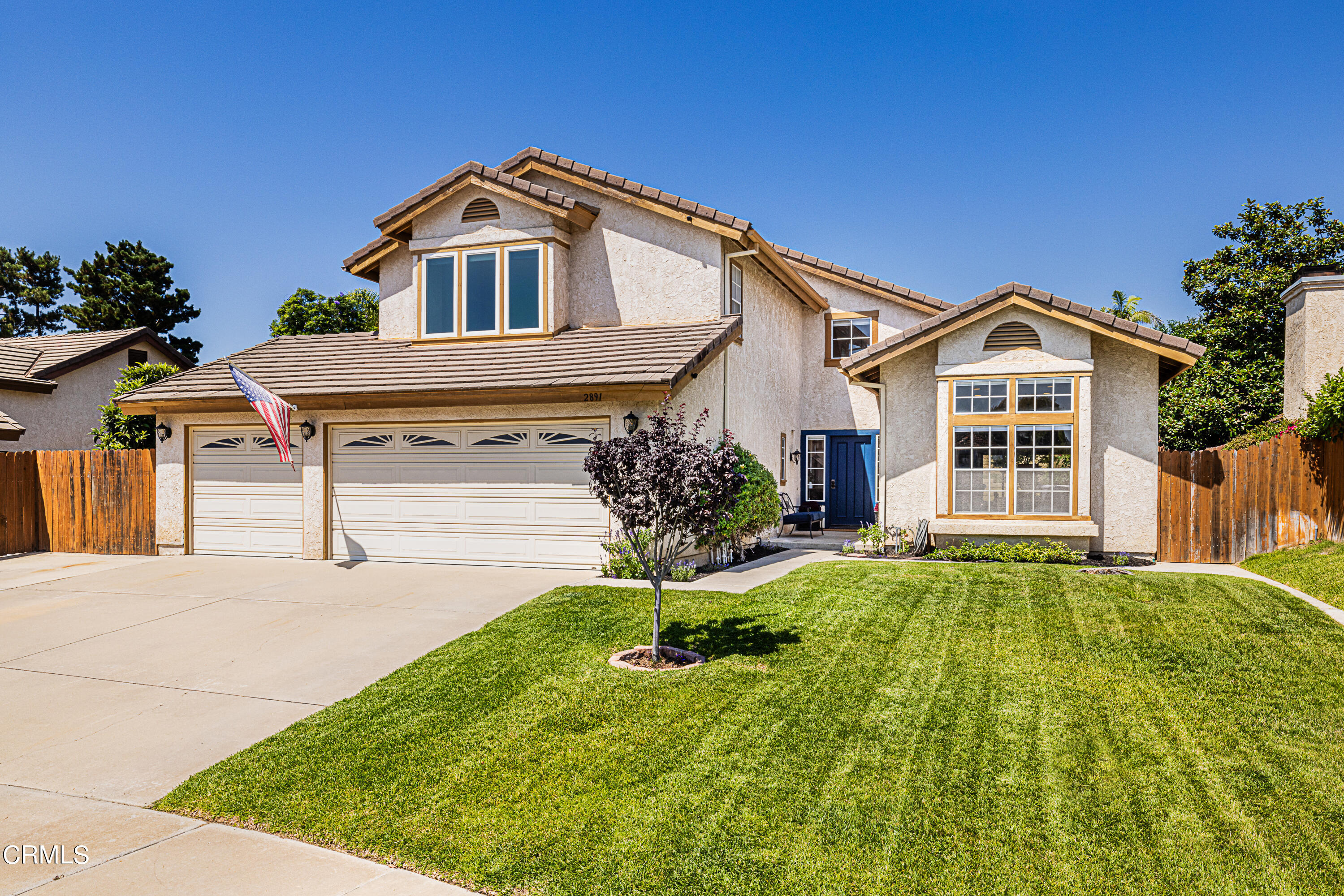 2891 Corte Caballos Camarillo, CA 93010 - Photo 2 of 30 a front view of a house with a yard