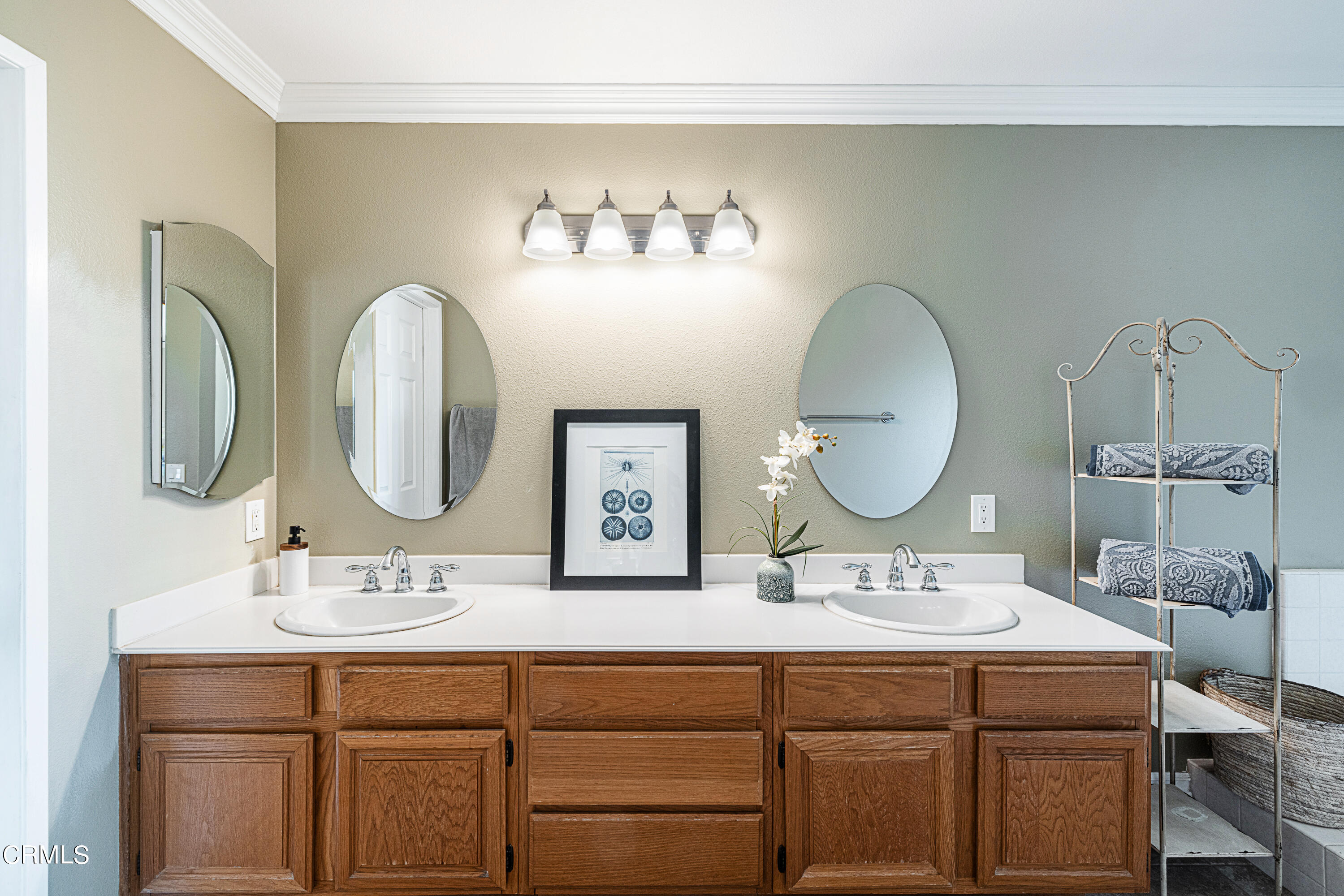 2891 Corte Caballos Camarillo, CA 93010 - Photo 21 of 30 a bathroom with a double vanity sink and a mirror