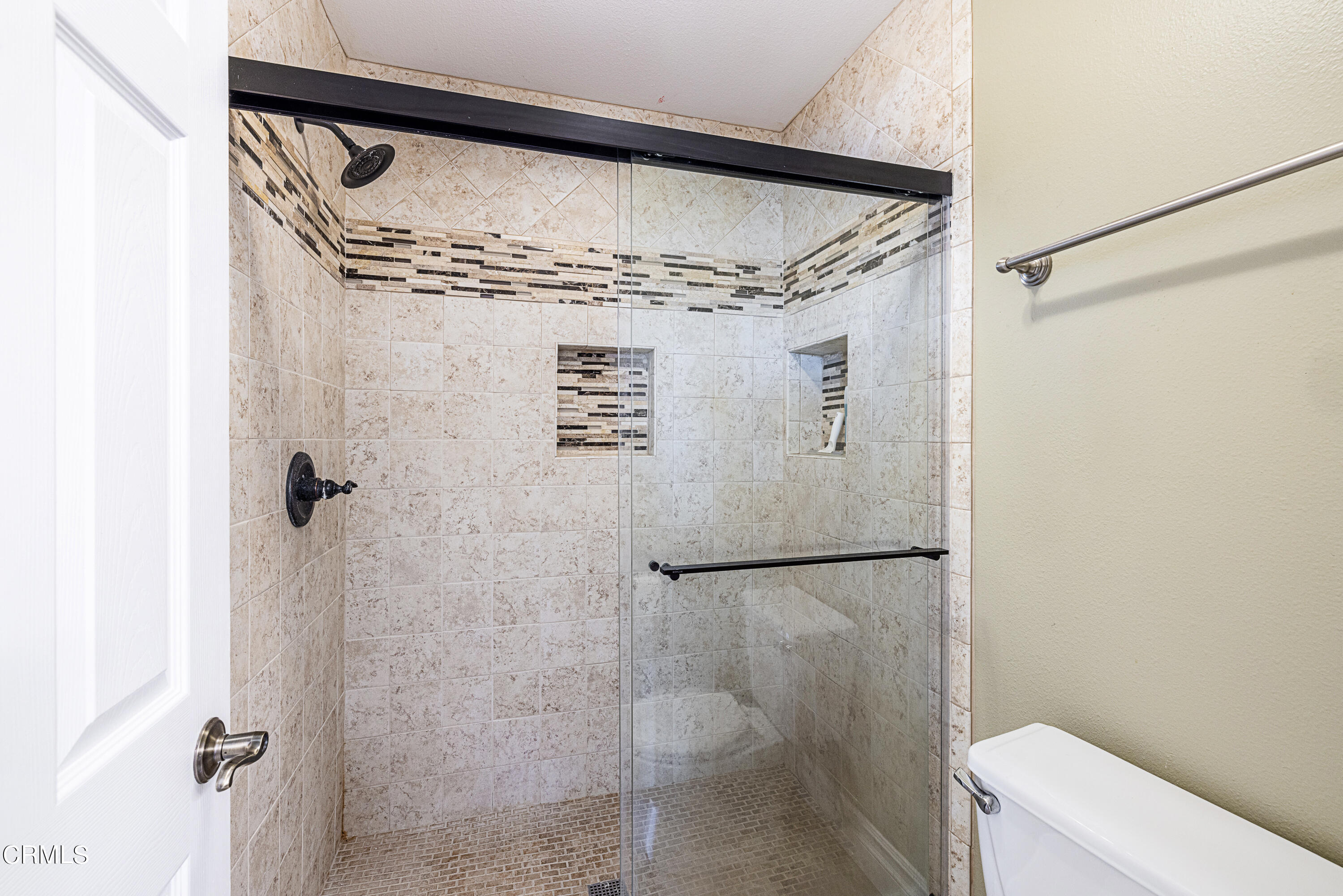 2891 Corte Caballos Camarillo, CA 93010 - Photo 23 of 30 a bathroom with a shower and toilet