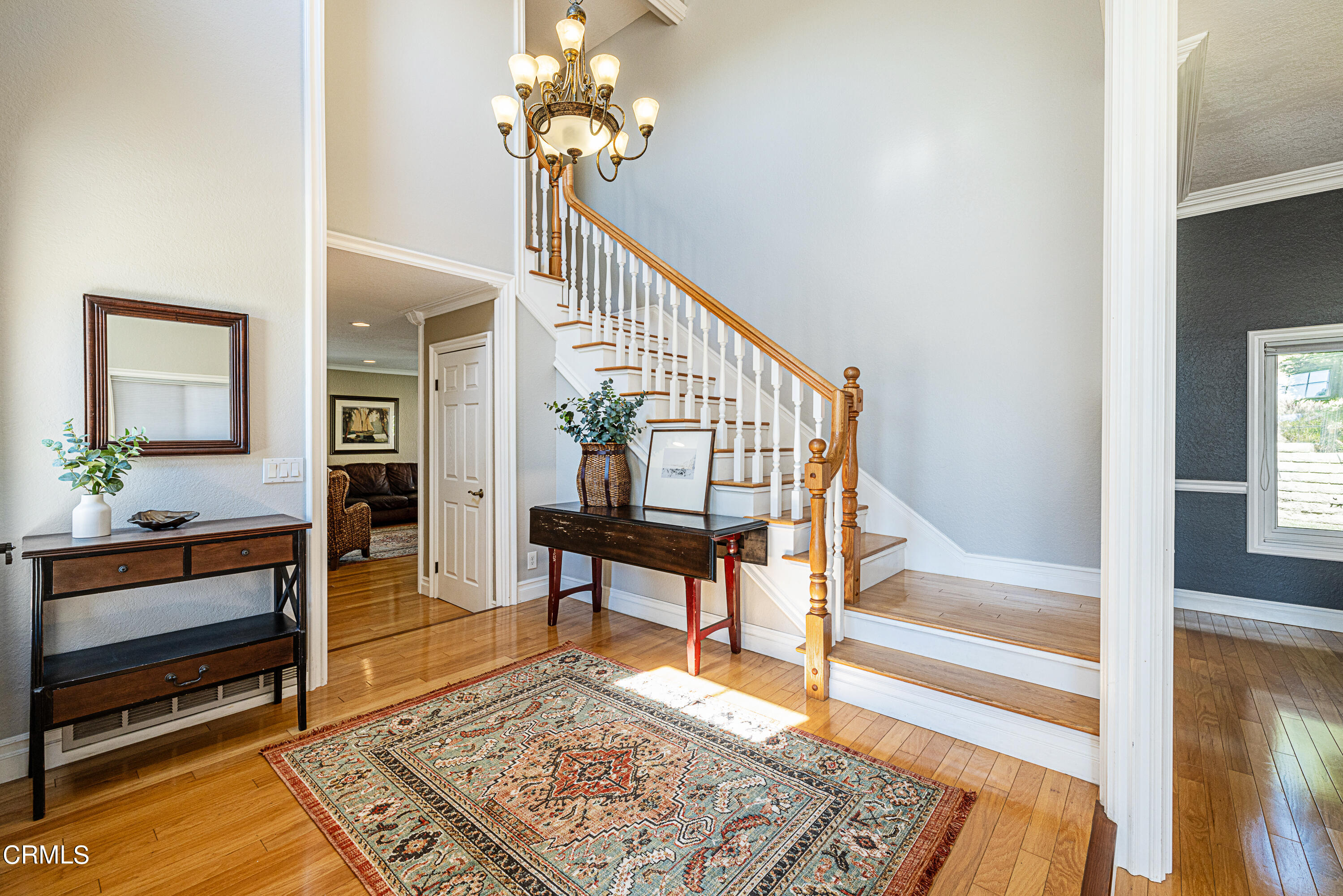 2891 Corte Caballos Camarillo, CA 93010 - Photo 4 of 30 a view of an entryway with wooden floor and a rug