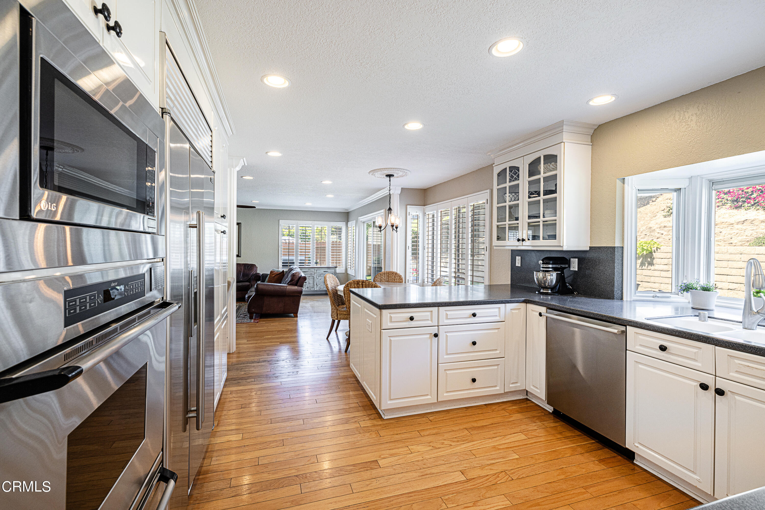 2891 Corte Caballos Camarillo, CA 93010 - Photo 7 of 30 a large kitchen with a lot of counter space and wooden floor