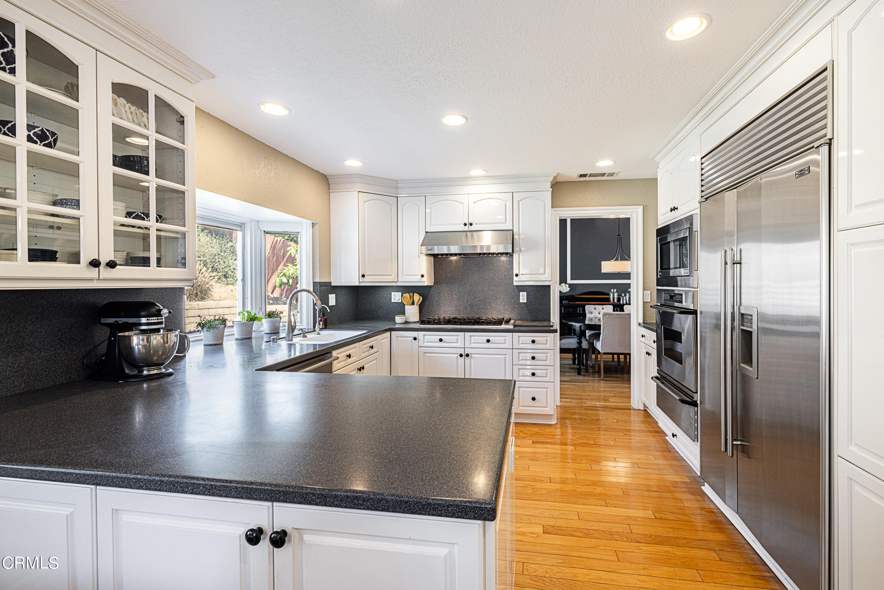 2891 Corte Caballos Camarillo, CA 93010 - Photo 10 of 30 a large kitchen with kitchen island a large counter top stainless steel appliances and cabinets