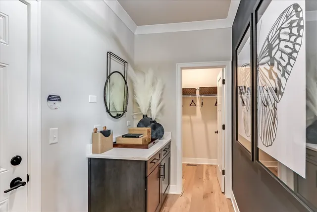 a bathroom with a sink a mirror and a shower