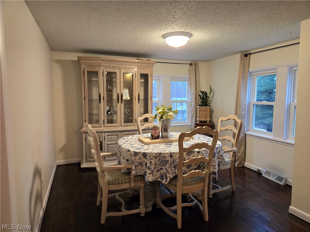 3186 Styx Hill Road Medina, OH 44256 - Photo 5 of 17 Eat-in Kitchen featuring dark hardwood wood-style flooring and ample windows