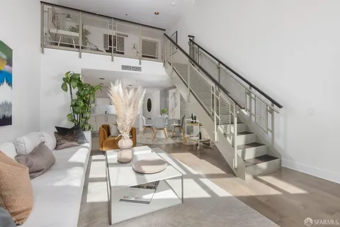 a living room with furniture and white walls