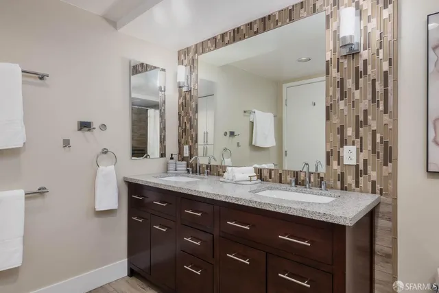 a view of a hallway with wooden floor windows and a livingroom