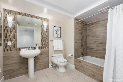 a spacious bedroom with a bed and a couch