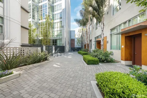 a front view of a building with outdoor seating