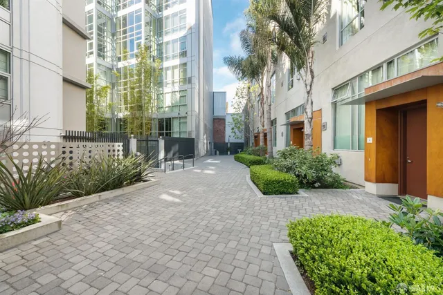 a front view of a building with outdoor seating