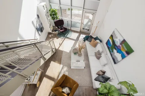 a work room with furniture and a large window