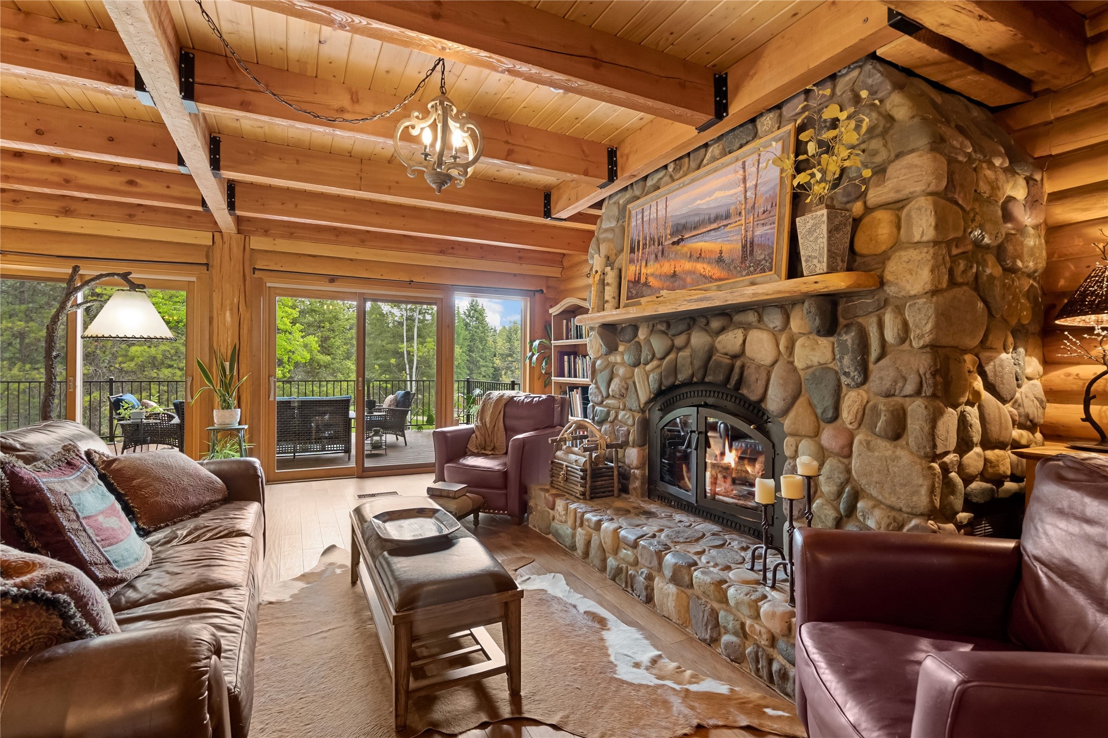 6485 Farm To Market Road Whitefish, MT 59937 - Photo 1 of 1 The great room is anchored by a majestic wood-burning fireplace, constructed with stones collected from the property itself.