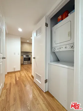 a view of kitchen with furniture and wooden floor